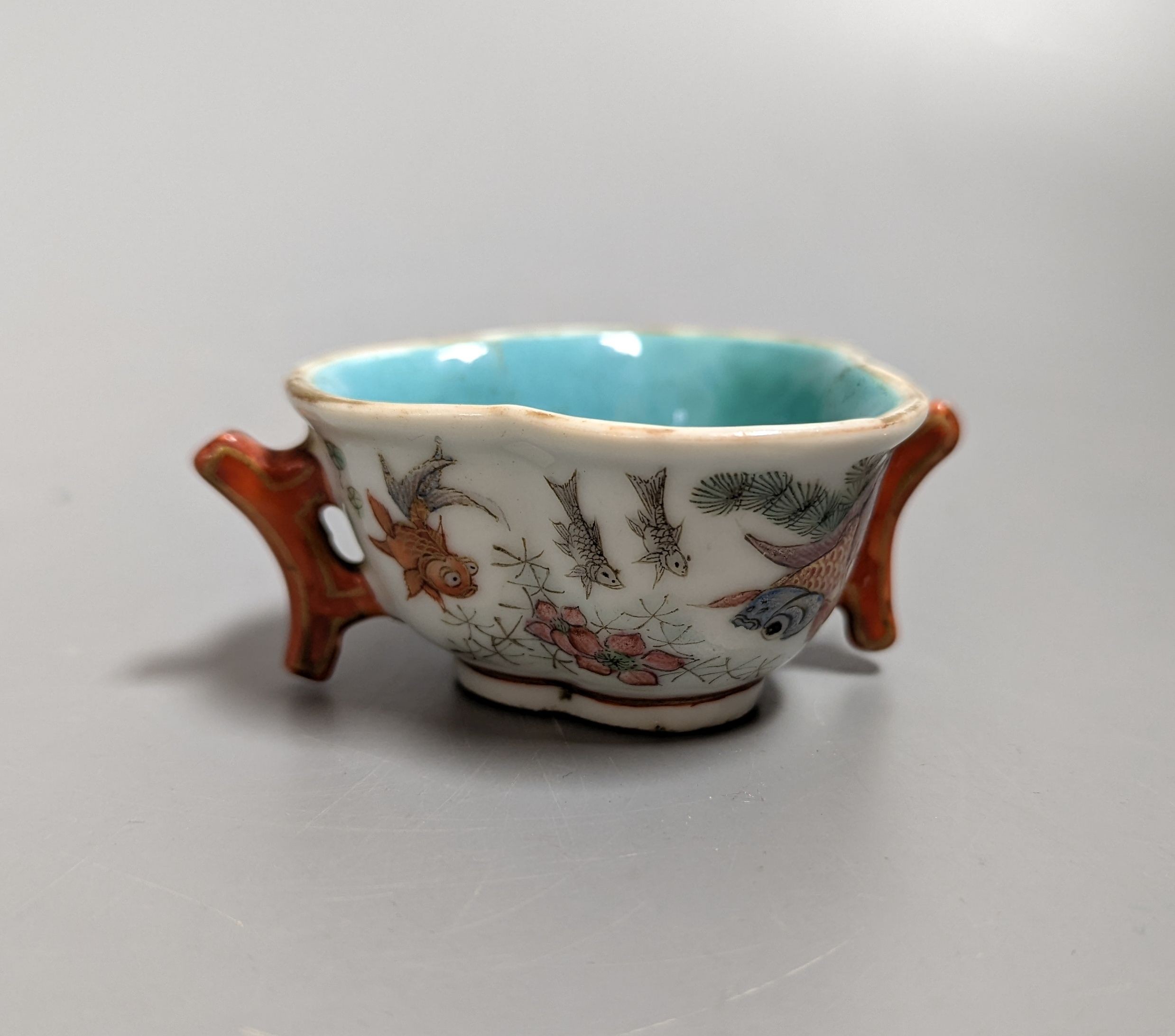 A Chinese enamelled porcelain 'goldfish' cup, Qianlong mark but 19th century, 3cms high